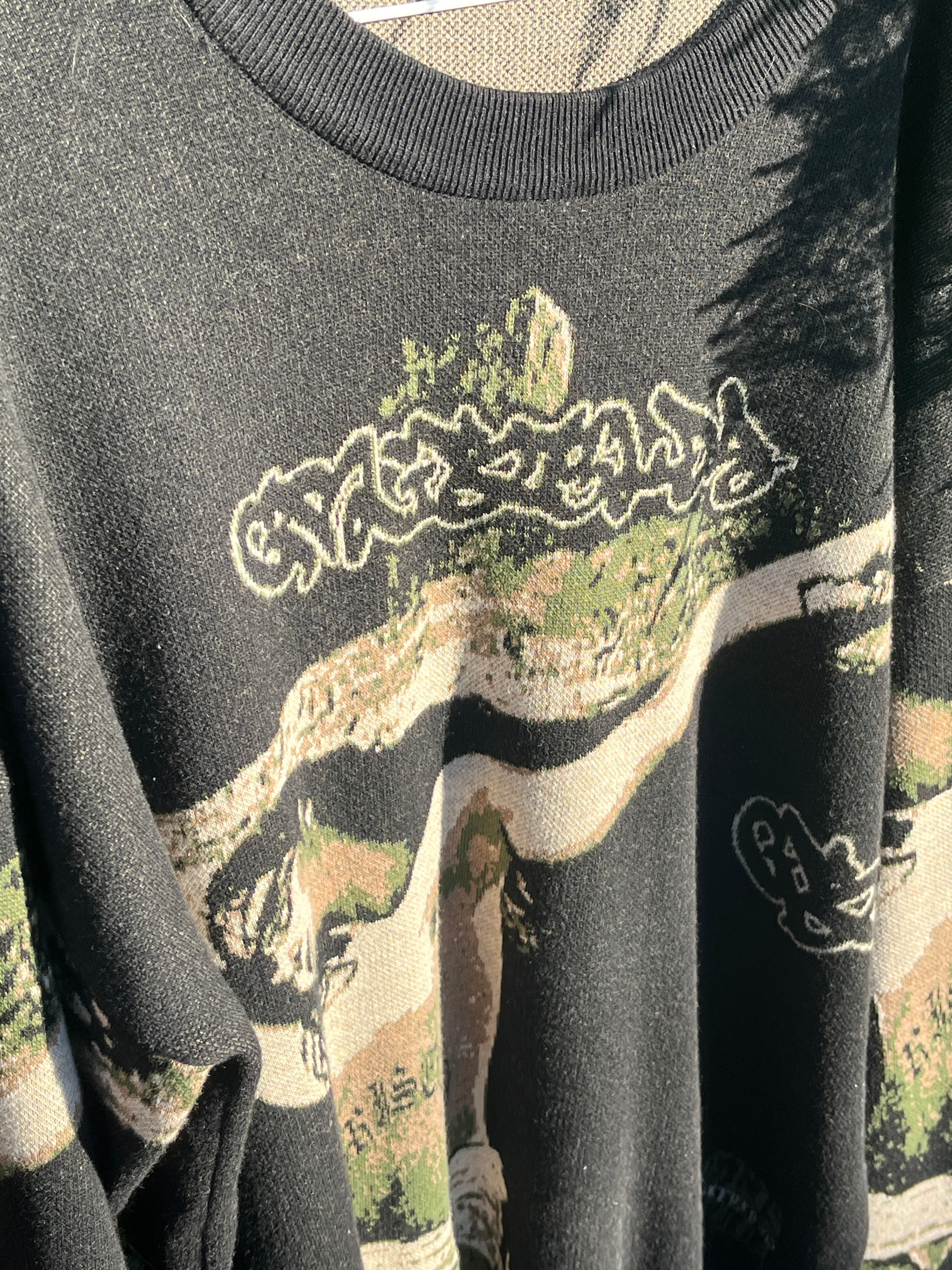 GSC premium knit sweater full view hanging outside showing oversized fit and  streetwear graphics